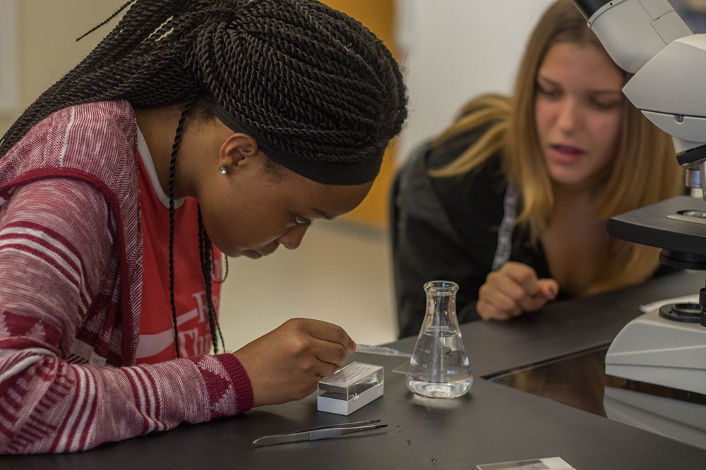 Pictured are students in the forensic science lab.